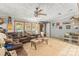 Comfortable living room with a ceiling fan, natural light and cozy brown sofa at 4155 Slanting Bridge Rd, Sherrills Ford, NC 28673