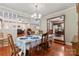 Inviting dining room with hardwood floors, chandelier, and seamless flow to the kitchen and living room at 4600 Beatties Ford Rd, Charlotte, NC 28216
