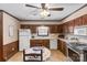 Well-lit kitchen with wood cabinets, tile countertops, and a practical layout at 4600 Beatties Ford Rd, Charlotte, NC 28216