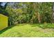 Lush backyard space with mature trees, a yellow shed and low ground cover at 509 S Clay St, Gastonia, NC 28052