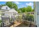 Deck with a table and chairs offers an inviting outdoor seating area at 509 S Clay St, Gastonia, NC 28052