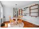 Cozy dining area with hardwood floors, chandelier, and decorative shelving on the wall at 509 S Clay St, Gastonia, NC 28052