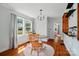Charming dining room with hardwood floors, decorative lighting, and natural light at 509 S Clay St, Gastonia, NC 28052