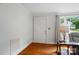 Light-filled entryway with hardwood floors, neutral walls, and a glimpse of the cozy living area at 509 S Clay St, Gastonia, NC 28052