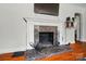 Close-up of stone fireplace with white mantle, providing a cozy focal point in the living room at 509 S Clay St, Gastonia, NC 28052