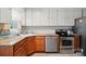 Classic kitchen features oak cabinets, stainless steel appliances, and granite countertops at 509 S Clay St, Gastonia, NC 28052