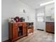 Galley kitchen with wood cabinets, a microwave, and an exterior door at 509 S Clay St, Gastonia, NC 28052