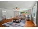 Inviting living room with large window, hardwood floors, ceiling fan, and comfortable seating at 509 S Clay St, Gastonia, NC 28052
