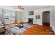 Cozy living room with hardwood floors, neutral color palette, fireplace, and comfortable seating, perfect for relaxation at 509 S Clay St, Gastonia, NC 28052