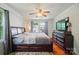 Comfortable bedroom with a ceiling fan and a wooden bed frame at 509 S Clay St, Gastonia, NC 28052
