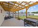 Inviting covered patio equipped with a grill, outdoor seating, and string lights perfect for relaxing at 5325 Merwyn Ave, Charlotte, NC 28215