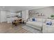 Bright living room featuring a comfortable sectional sofa, hardwood floors, and stylish decor at 5325 Merwyn Ave, Charlotte, NC 28215