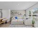 Spacious living room boasting a large sectional, ample natural light, and modern decorative elements at 5325 Merwyn Ave, Charlotte, NC 28215