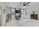 The primary bedroom features a ceiling fan and lots of natural light at 5325 Merwyn Ave, Charlotte, NC 28215
