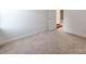 Cozy bedroom with neutral carpet features an open doorway leading to another space at 533 Montgrove Nw Pl, Concord, NC 28027