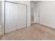 Neutral bedroom with a large closet and door leading to another room, providing ample space and natural light at 533 Montgrove Nw Pl, Concord, NC 28027