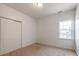 The bedroom features a large closet, neutral paint, and natural light at 533 Montgrove Nw Pl, Concord, NC 28027