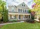 Charming two-story home with black shutters and a welcoming front porch perfect for relaxing at 533 Montgrove Nw Pl, Concord, NC 28027