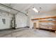 Spacious garage with shelving and water heater at 533 Montgrove Nw Pl, Concord, NC 28027