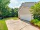 Attached garage with spacious driveway and lawn at 533 Montgrove Nw Pl, Concord, NC 28027