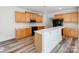 Well-equipped kitchen boasts stainless steel appliances, stylish countertops, and a functional kitchen island at 533 Montgrove Nw Pl, Concord, NC 28027