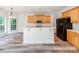 Modern kitchen featuring an island with bar seating, stainless steel appliances, and ample cabinet space at 533 Montgrove Nw Pl, Concord, NC 28027
