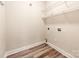 Practical laundry room with shelving offers convenience and space for storage at 533 Montgrove Nw Pl, Concord, NC 28027