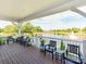 Covered patio featuring furniture and view of the pond at 533 Montgrove Nw Pl, Concord, NC 28027