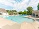 Large community pool with seating and covered picnic areas at 533 Montgrove Nw Pl, Concord, NC 28027