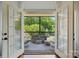 Charming outdoor balcony features comfortable seating and a view of the lush backyard at 581 Medora Ln, Fort Mill, SC 29708