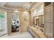 An elegant bathroom with a double vanity, large mirrors, and a separate shower at 581 Medora Ln, Fort Mill, SC 29708