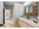 Bright bathroom with elegant vanity, modern fixtures, and access to the bedroom at 581 Medora Ln, Fort Mill, SC 29708