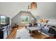 Spacious bonus room includes a comfortable seating area and a foosball table at 581 Medora Ln, Fort Mill, SC 29708