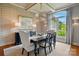 Elegant dining room featuring textured walls, modern lighting, and a large window view at 581 Medora Ln, Fort Mill, SC 29708