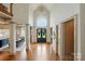 Grand foyer with soaring ceilings, hardwood floors, and elegant chandelier lighting at 581 Medora Ln, Fort Mill, SC 29708