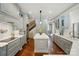 A modern kitchen featuring gray cabinets, hardwood floors, and stainless steel appliances at 581 Medora Ln, Fort Mill, SC 29708