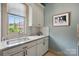 The laundry room has plenty of counter space, cabinets, a sink and a window view at 581 Medora Ln, Fort Mill, SC 29708