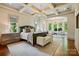 A spacious primary bedroom with trey ceilings, many windows, and a seating area at 581 Medora Ln, Fort Mill, SC 29708