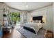 Beautiful main bedroom with a door that leads to the refreshing private pool area at 581 Medora Ln, Fort Mill, SC 29708