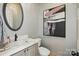 Stylish powder room with a modern sink, framed art, mirror, and neutral paint at 581 Medora Ln, Fort Mill, SC 29708