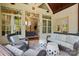 Inviting sunroom with comfortable seating, providing a relaxing indoor-outdoor experience at 581 Medora Ln, Fort Mill, SC 29708