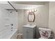 Tidy bathroom featuring a combined shower-tub and a modern sink and toilet at 603 Sunnybrook Dr, Monroe, NC 28110