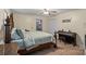 Bright bedroom featuring a decorative bedframe, closet, and piano at 603 Sunnybrook Dr, Monroe, NC 28110