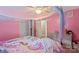 Whimsical bedroom with pink walls, canopy bed, and cozy decor at 603 Sunnybrook Dr, Monroe, NC 28110
