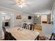 Charming dining room boasts natural light and access to the kitchen and other living spaces at 603 Sunnybrook Dr, Monroe, NC 28110