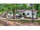 Inviting one-story home boasts a well-manicured front yard and a classic brick exterior at 603 Sunnybrook Dr, Monroe, NC 28110
