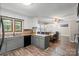 Spacious eat-in kitchen features sleek cabinets and countertops with stainless steel appliances at 603 Sunnybrook Dr, Monroe, NC 28110