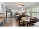 Bright eat-in kitchen features stainless steel appliances, granite counters, and a window overlooking the backyard at 603 Sunnybrook Dr, Monroe, NC 28110
