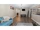 Inviting living room featuring wood floors, neutral paint, and easy access to other rooms at 603 Sunnybrook Dr, Monroe, NC 28110