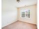 Neutral bedroom with a window and carpet flooring at 6227 Castlecove Rd, Charlotte, NC 28278